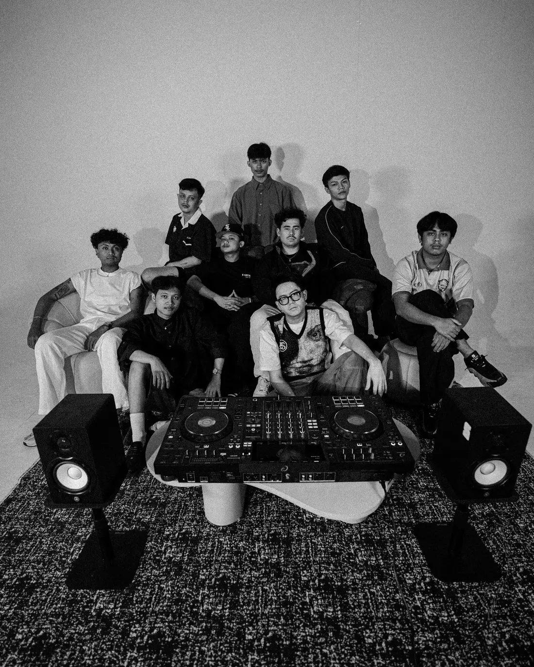 The Spinral crew on the studio sofa behind the decks